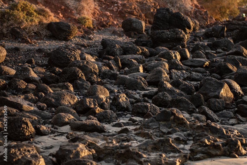 Lava rocks on a beach in canary islands fuerteventura Lava rocks on a beach in canary islands fuerteventura