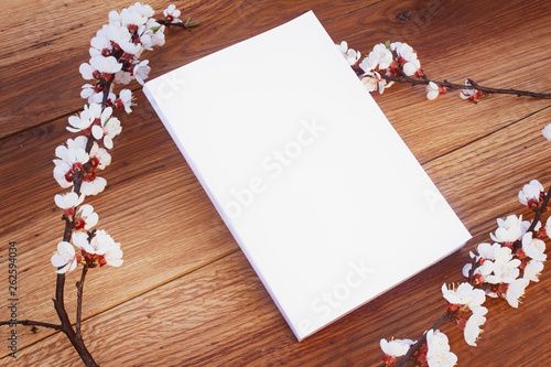 Realistic Mock up Magazine Cover with Blossom, on wooden background.
