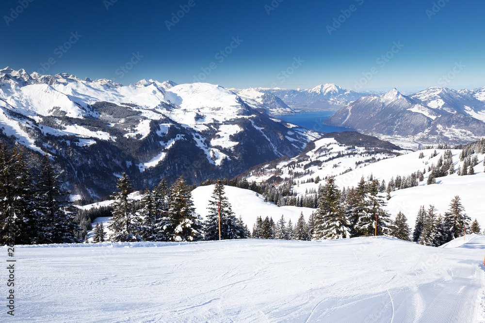 Beautiful winter landscape. People skiing in Hoch Ybrig ski resort, Switzerland, Europe.