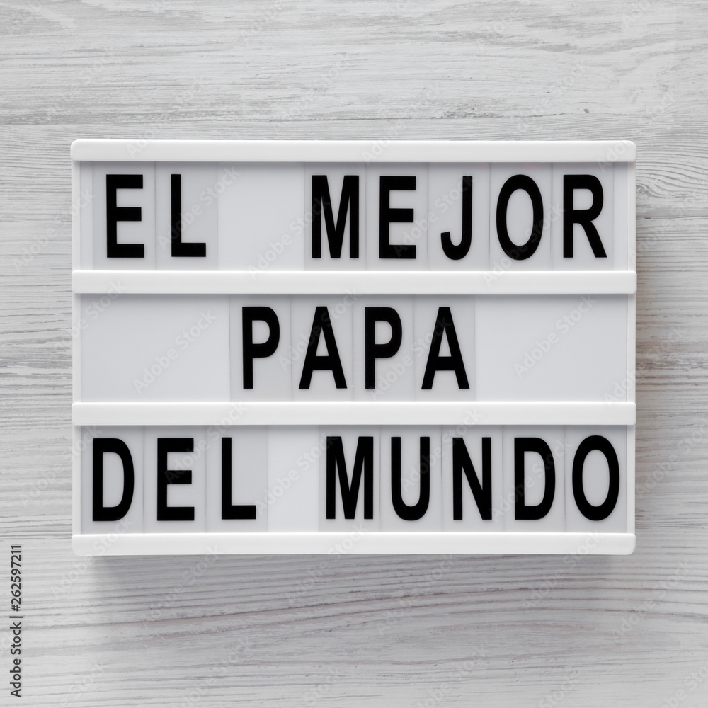 'El Mejor Papa Del Mundo' words on a lightbox over white wooden background, top view. Overhead, from above, flat lay. 'El Mejor Papa Del Mundo' words on a lightbox over white wooden background, top view. Overhead, from above, flat lay.