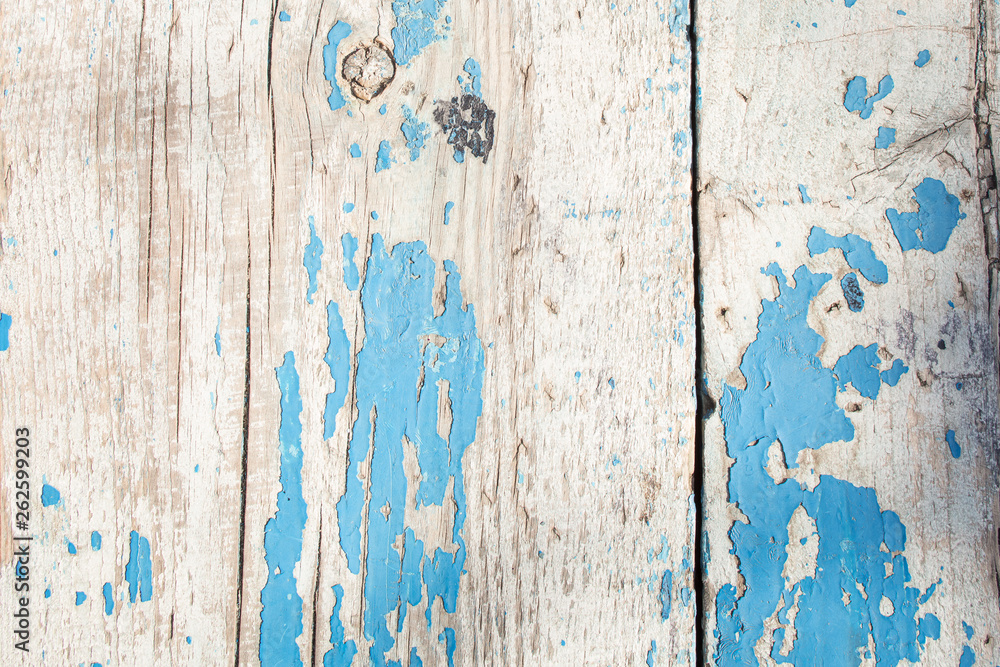 cracked horizontal wooden panel with peeling blue paint cracked horizontal wooden panel with peeling blue paint