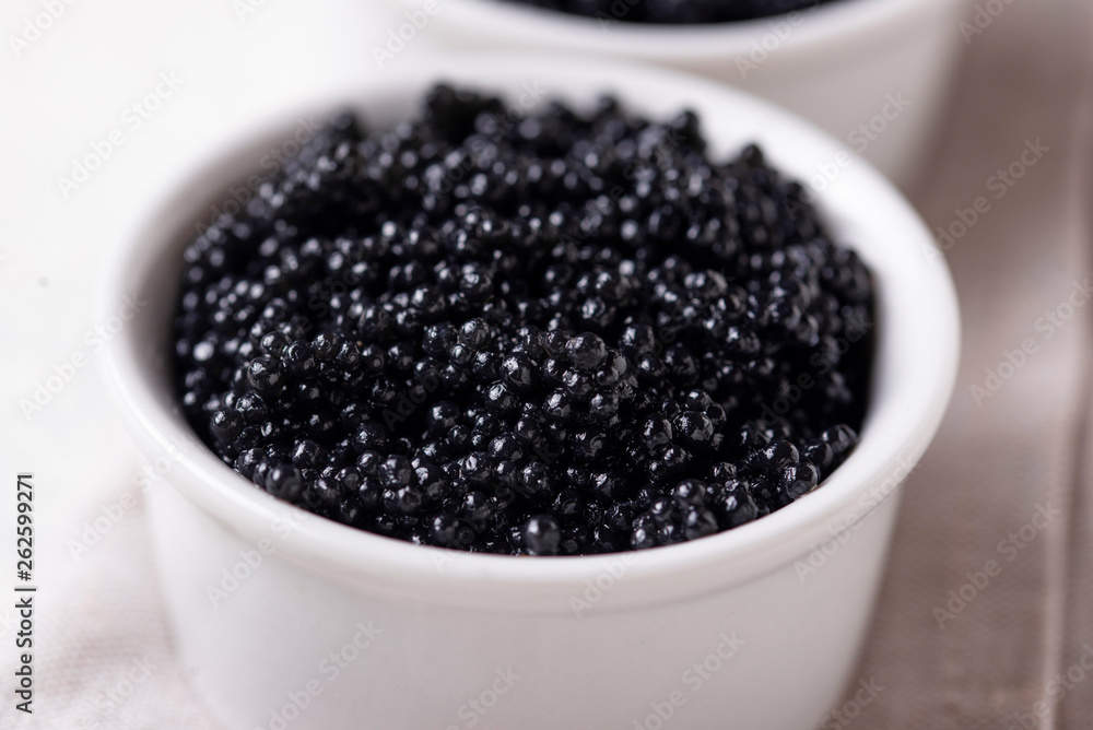 Sturgeon black caviar in bowls Sturgeon black caviar in bowls
