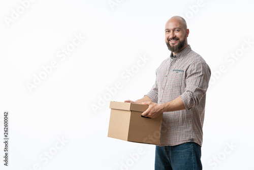 Portrait of a handsome young man holding card boxes, isolated on white