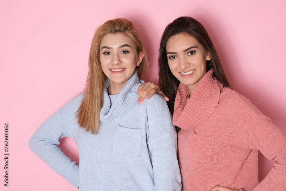 Two totally different looking sisters making funny faces at studio shoot. Two totally different looking sisters making funny faces at studio shoot.