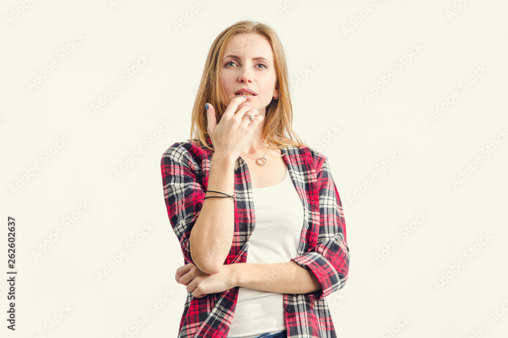 Want to dream! Beautiful happy young woman thought, dreaming, looking up standing on a light background. Want to dream! Beautiful happy young woman thought, dreaming, looking up standing on a light background.