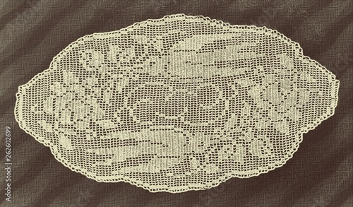 Handmade doily background texture grunge. Crocheted motive. Square tablecloth with flowers.
