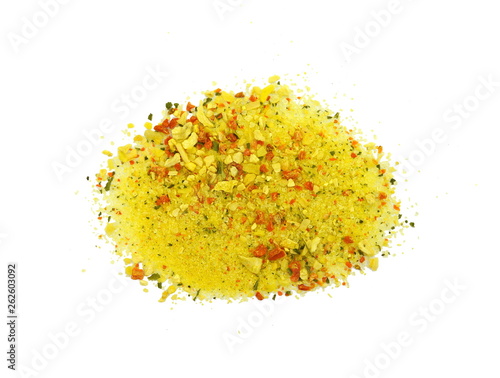 Grounded spice ingredient of dry mix vegetables isolated on white. Vegeta spices. A pile of a yellow spice mix. Spices consist dried dehydrated vegetables carrot paprika onion garlic parsnip parsley 