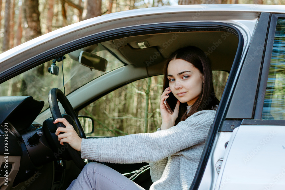 female driver talks on the phone