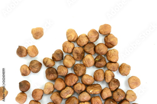 Heap of hazelnuts isolated on white background