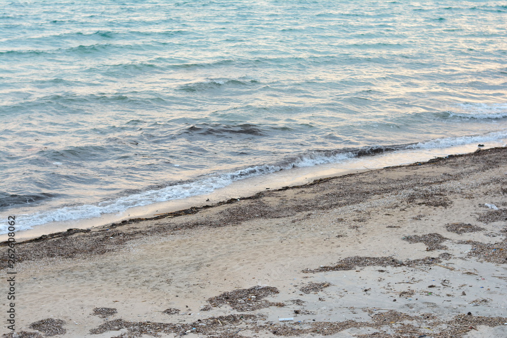 Beautiful soft waves of Blue Ocean with Sandy Beach Background close up. Sea sand wallpaper Beautiful soft waves of Blue Ocean with Sandy Beach Background close up. Sea sand wallpaper