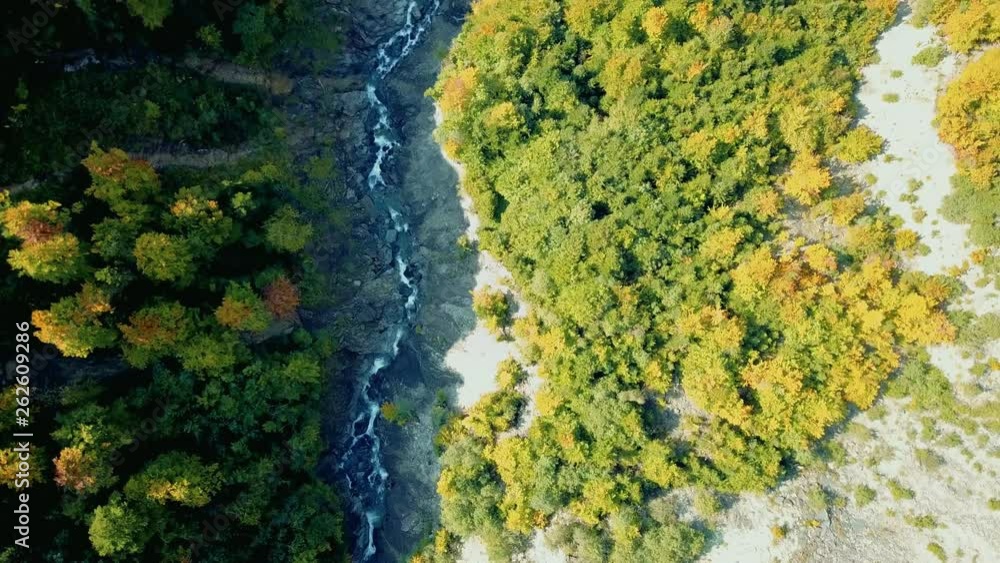 Aerial view of deep valley with wild river. Smooth and stabilized footage from drone flying above landscape. Swiss alps in Europe. Aerial view of deep valley with wild river. Smooth and stabilized footage from drone flying above landscape. Swiss alps in Europe.