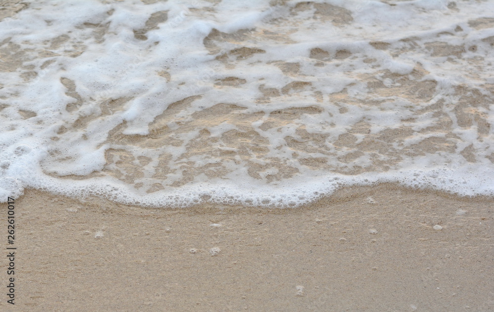 Beautiful soft waves of Blue Ocean with Sandy Beach Background close up. Sea sand wallpaper Beautiful soft waves of Blue Ocean with Sandy Beach Background close up. Sea sand wallpaper