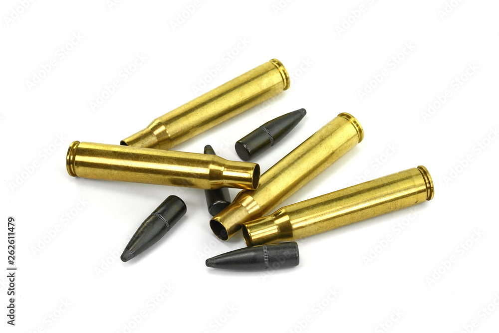 A rifle bullet, empty shell on white background. A rifle bullet, empty shell on white background.
