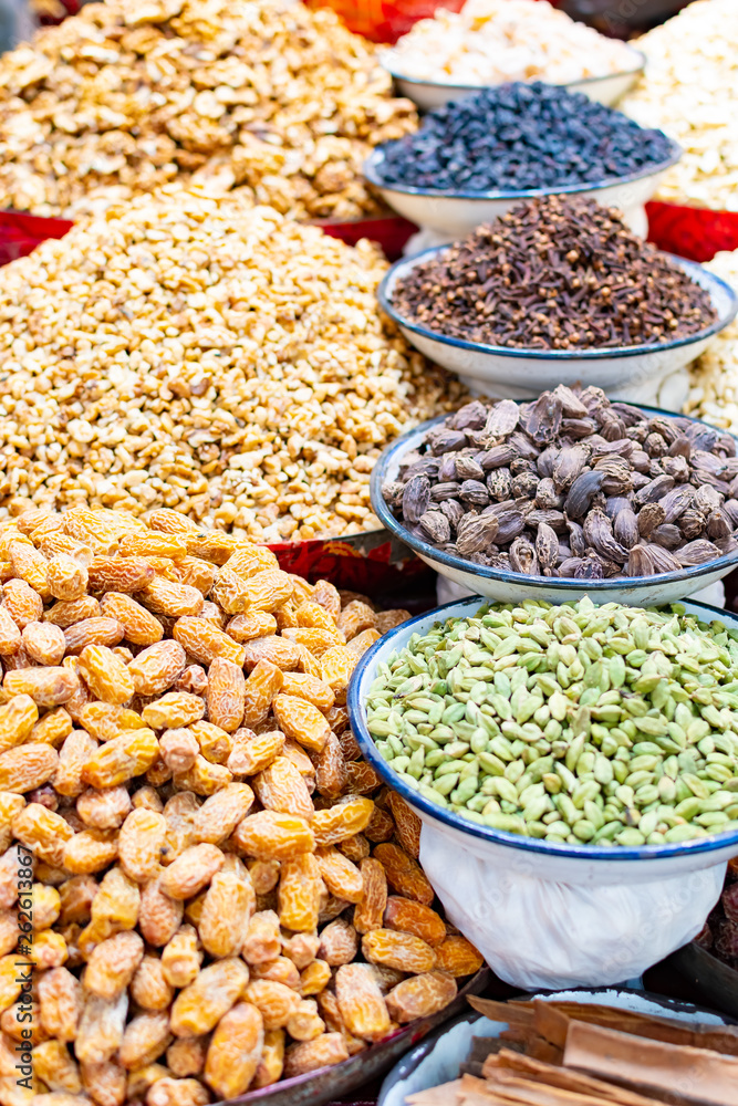 Traditional spices, dry fruits and nuts in local spicy bazaar in New Delhi, India