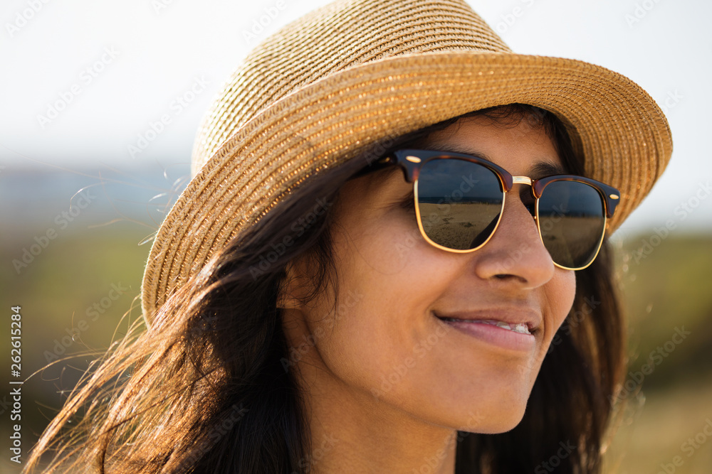Fototapeta premium Young indian woman smiling in the countryside