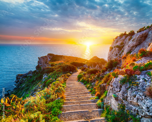 Dramatic spring sunset on the the cape Milazzo panorama of nature reserve Piscina di Venere.