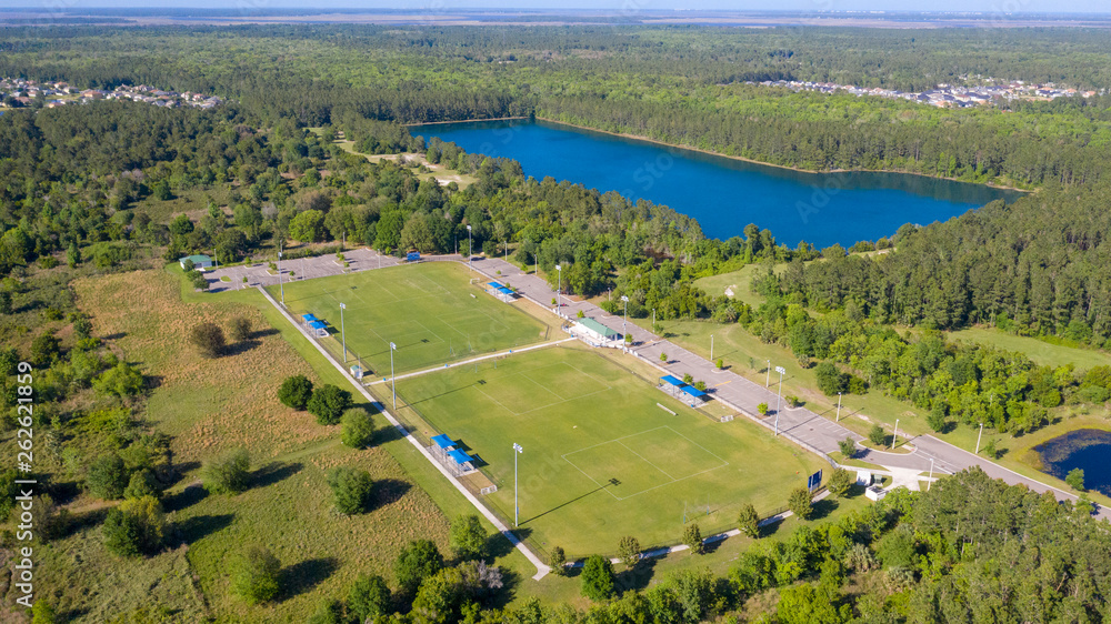 Football / Soccer field and large lake.