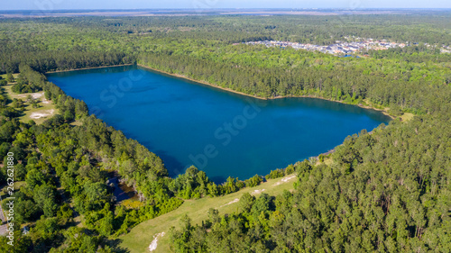 Large blue lake in community park. 