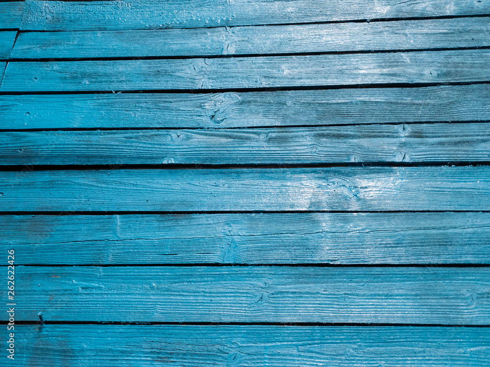 Wooden fence of blue boards. Boards blue. Blue wooden background. Wooden fence of blue boards. Boards blue. Blue wooden background.