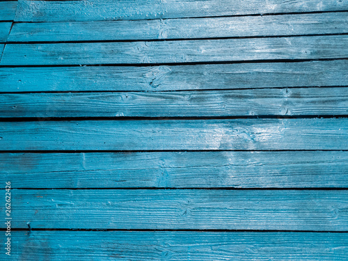 Wooden fence of blue boards. Boards blue. Blue wooden background.