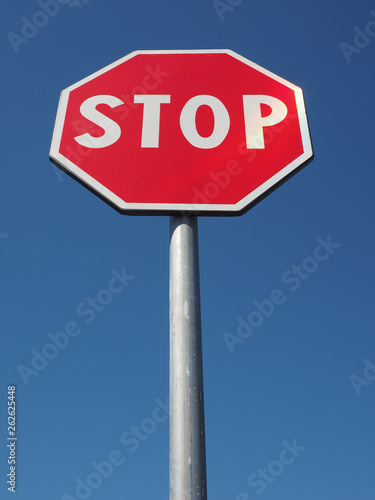 stop sign over blue sky