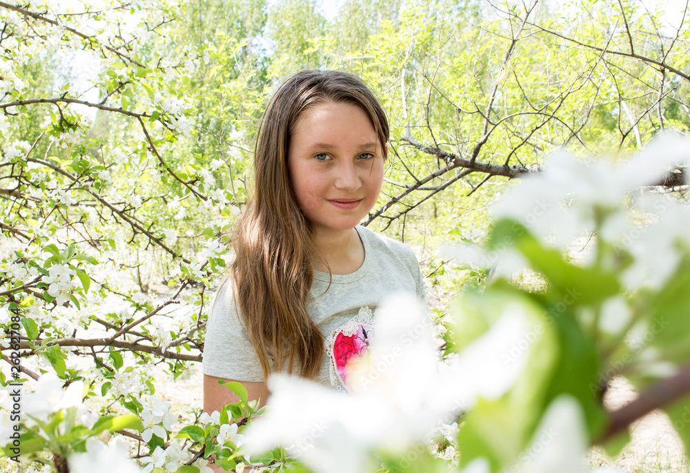 Portrait of a girl in flowers, apple flower Portrait of a girl in flowers, apple flower