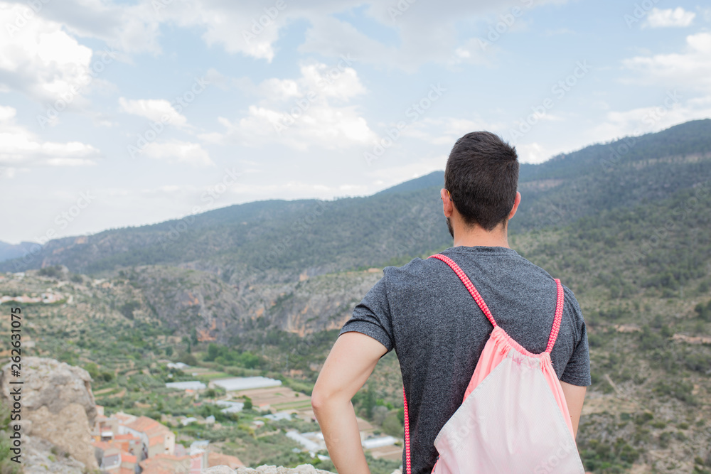 young man looking away in the mountain young man looking away in the mountain