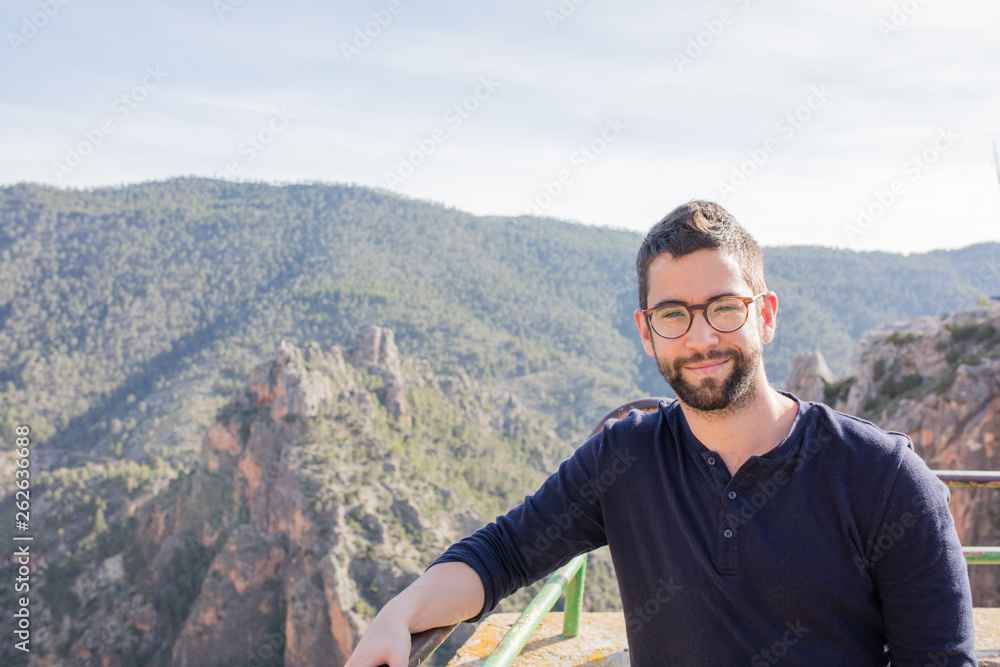 young man happy and laughing in the mountain young man happy and laughing in the mountain