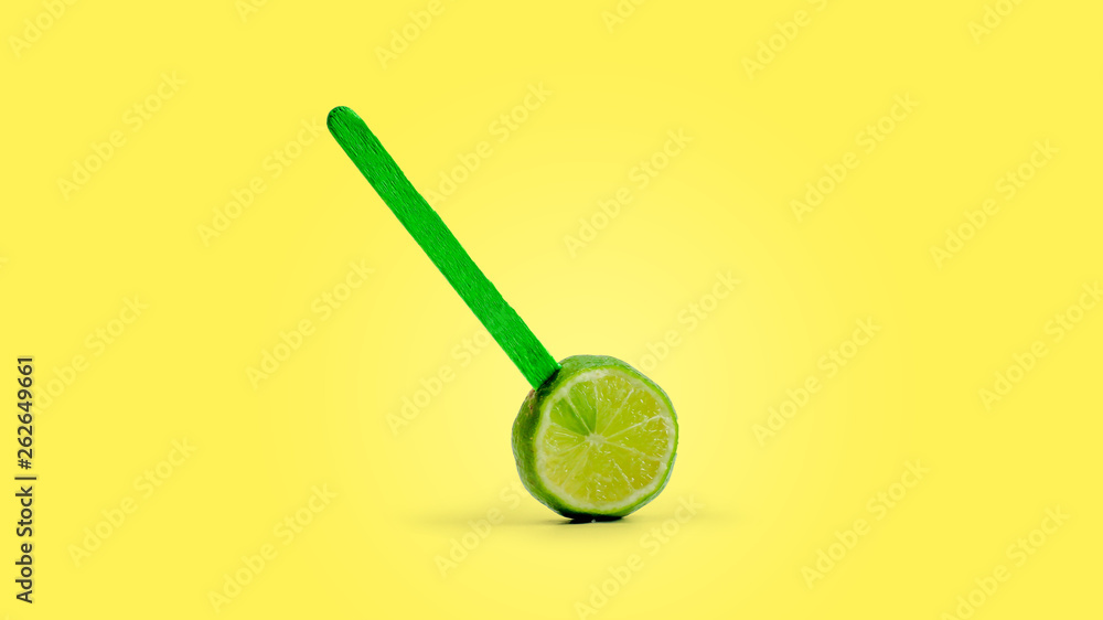 sliced lemon fruit on a stick. yellow background sliced lemon fruit on a stick. yellow background