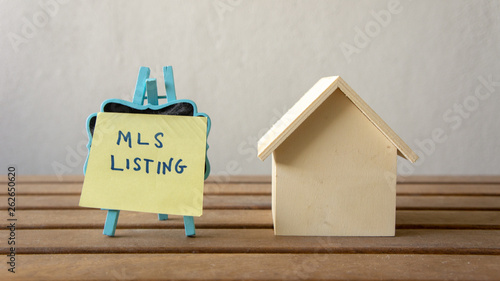 House or home model with text MLS (Multiple listing service) Listing (For Sale by Owner). Property or real estate concept.