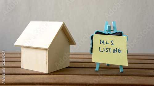 House or home model with text MLS (Multiple listing service) Listing (For Sale by Owner). Property or real estate concept.