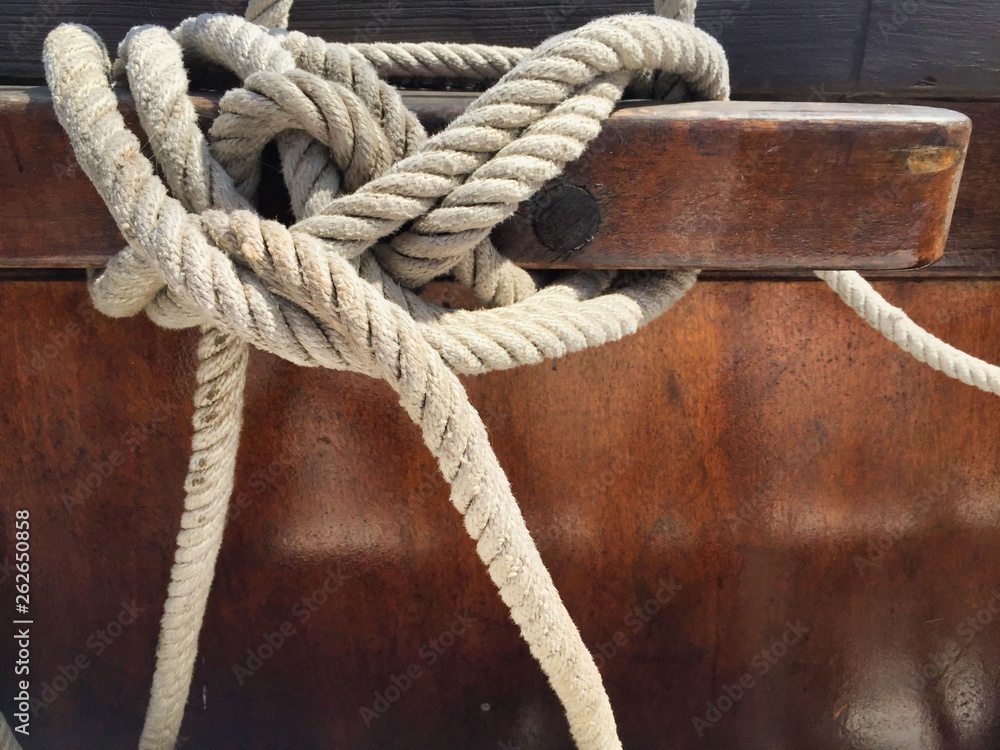 Nautical knot on wodden tie down