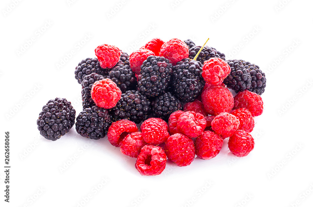 pile of raspberries and blackberries with leaves isolated on white background pile of raspberries and blackberries with leaves isolated on white background