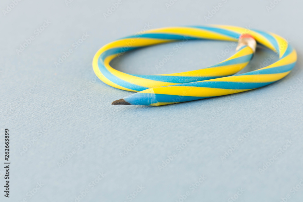 Flexible pencil . Isolated on light background. Bending pencil. Flexible pencil . Isolated on light background. Bending pencil.