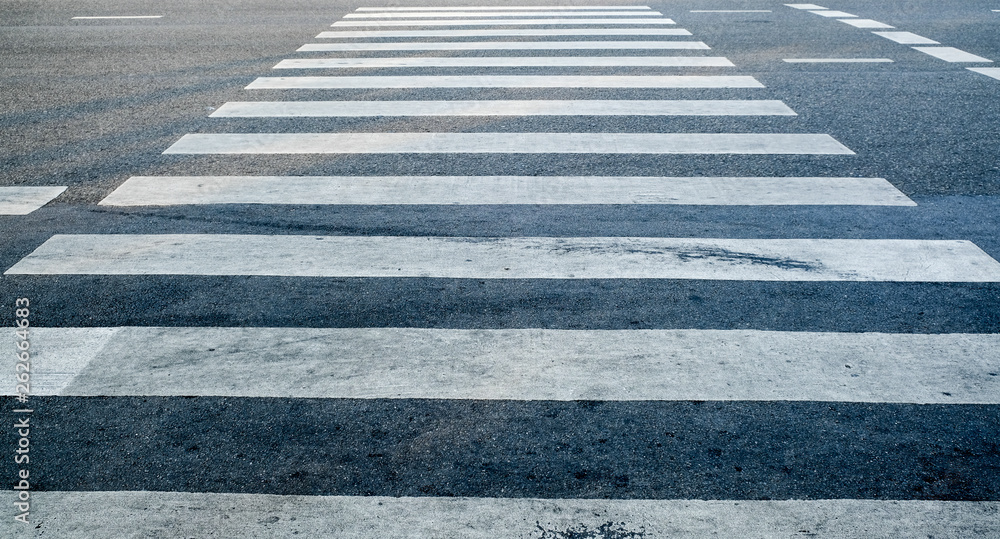 crosswalk on the road for safety when people walking cross the street, Pedestrian crossing on a repaired asphalt road, Crosswalk on the street for safety. crosswalk on the road for safety when people walking cross the street, Pedestrian crossing on a repaired asphalt road, Crosswalk on the street for safety.