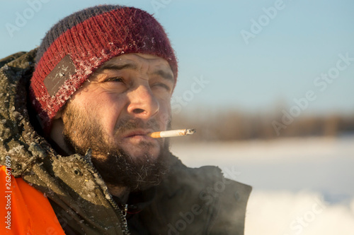 Portrait of a fitter with a cigarette in his mouth