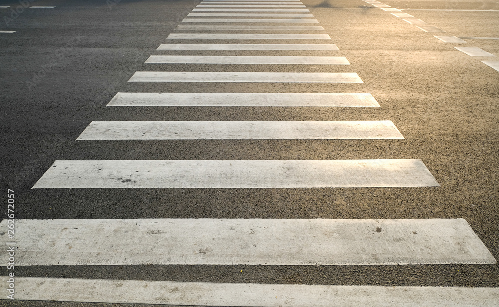 crosswalk on the road for safety when people walking cross the street, Pedestrian crossing on a repaired asphalt road, Crosswalk on the street for safety. crosswalk on the road for safety when people walking cross the street, Pedestrian crossing on a repaired asphalt road, Crosswalk on the street for safety.
