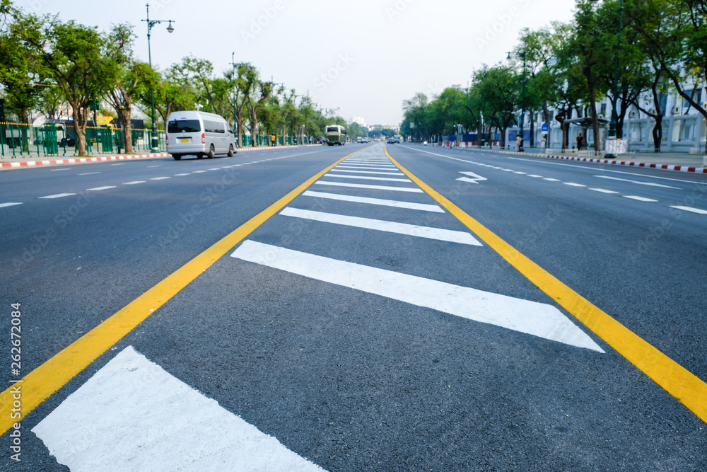 crosswalk on the road for safety when people walking cross the street, Pedestrian crossing on a repaired asphalt road, Crosswalk on the street for safety. crosswalk on the road for safety when people walking cross the street, Pedestrian crossing on a repaired asphalt road, Crosswalk on the street for safety.