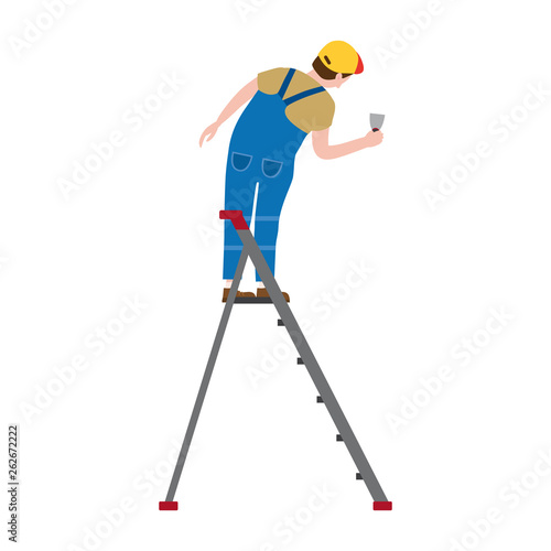 Professional working man on a stepladder applies plaster