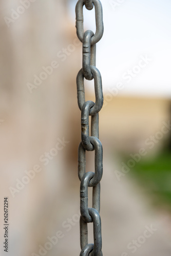 Metal chain on blurry background