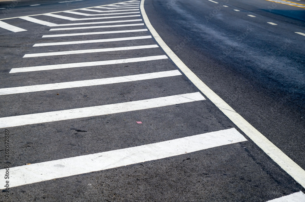 crosswalk on the road for safety when people walking cross the street, Pedestrian crossing on a repaired asphalt road, Crosswalk on the street for safety. crosswalk on the road for safety when people walking cross the street, Pedestrian crossing on a repaired asphalt road, Crosswalk on the street for safety.