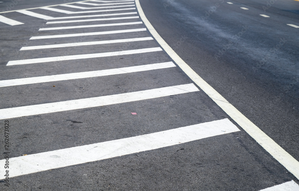 crosswalk on the road for safety when people walking cross the street, Pedestrian crossing on a repaired asphalt road, Crosswalk on the street for safety. crosswalk on the road for safety when people walking cross the street, Pedestrian crossing on a repaired asphalt road, Crosswalk on the street for safety.