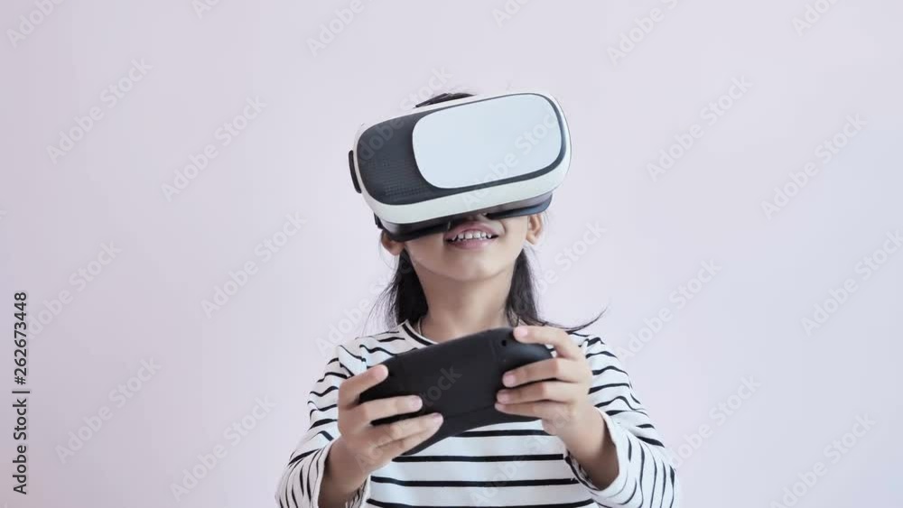 Girl playing game with VR and joystick with happiness Girl playing game with VR and joystick with happiness