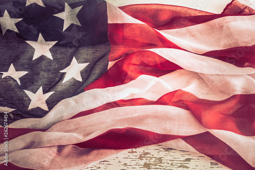 Fototapeta Naklejka Na Ścianę i Meble -  Patriotic symbolism. American flag on wooden background