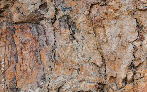 old stone wall in the cracks. texture of marble stone