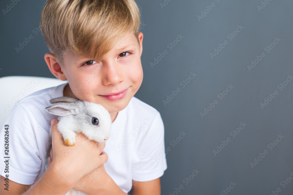 Little boy white Tshirt and tame dwarfish rabbit Little boy white Tshirt and tame dwarfish rabbit