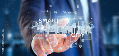 Businessman holding Smart city user interface with icon, stats and data 3d rendering