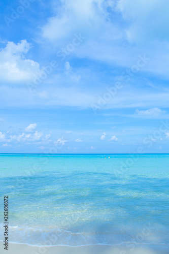 The beauty of the summer beach and the clear sea on the bright sky. © apichon_tee