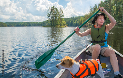 Woman paddling with canoe