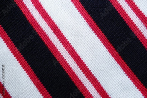 striped knitted fabric close-up knitted fabric macro background lines geometrical pattern black red white